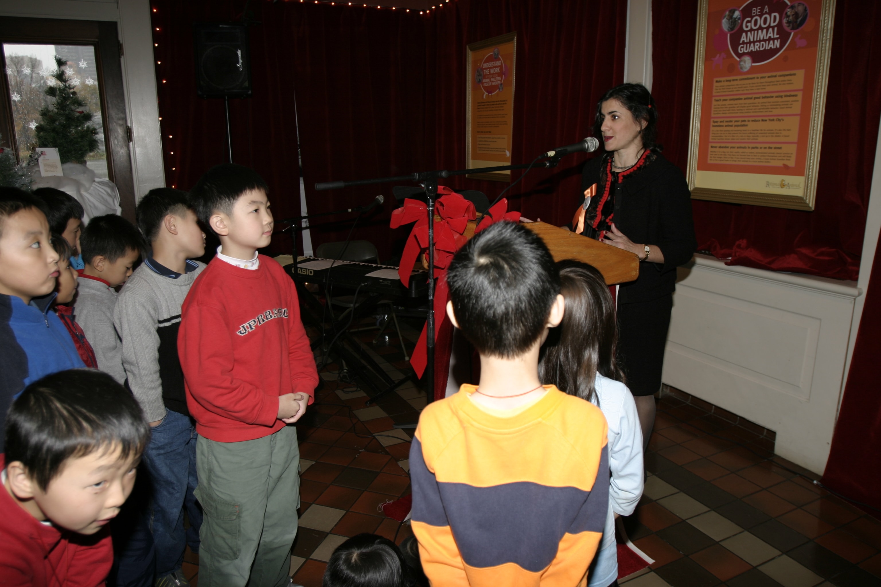 Schoolchildren attending the animal welfare educational presentation at the Gingerbread Homes for Animals event